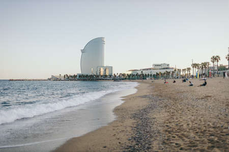 A sandy beach next to a body of waterの写真素材