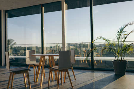 A dining room table in front of a windowの写真素材