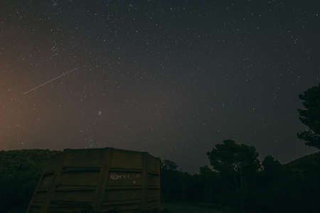A white sign with red and blue sky in the backgroundの写真素材
