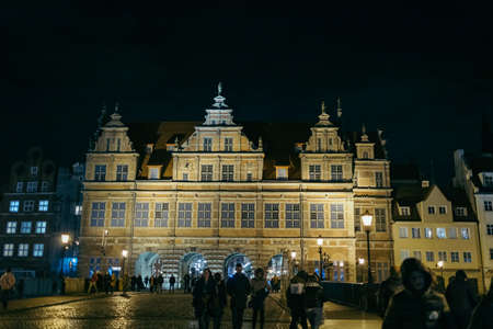 A group of people standing in front of a building