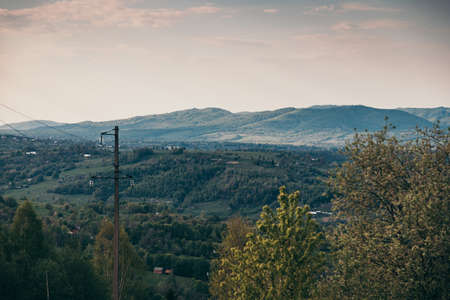 A sign with a mountain in the backgroundの写真素材