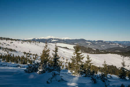 A close up of a snow covered mountainの写真素材