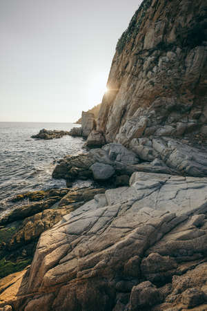 A close up of a rock near the oceanの写真素材