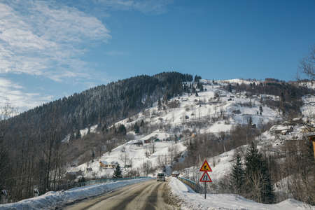 A person riding skis down a snow covered mountainの写真素材