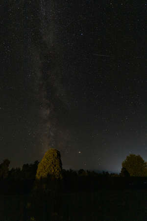 A sign in a dark skyの写真素材