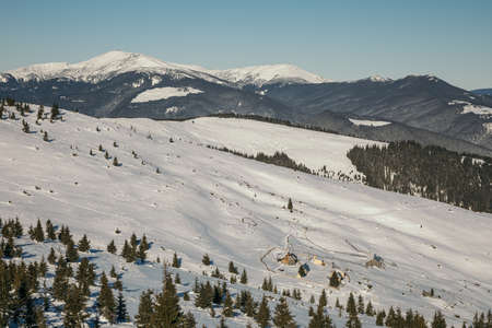 A man standing on top of a snow covered mountainの写真素材