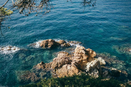A close up of a rock near the oceanの写真素材
