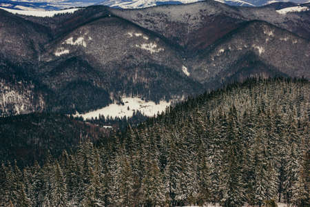 A group of people standing on top of a mountainの写真素材