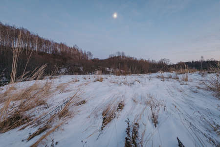 A man riding skis down a snow covered slopeの写真素材