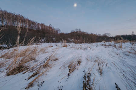 A man riding skis down a snow covered slopeの写真素材
