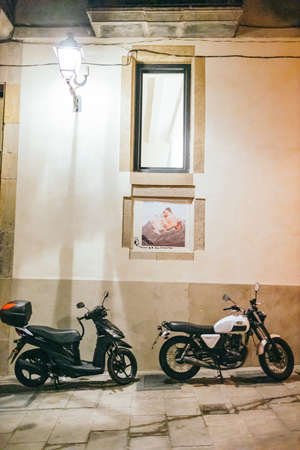A motorcycle parked in front of a buildingの写真素材