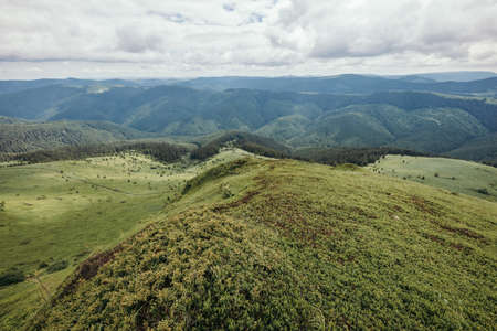 A field with a mountain in the backgroundの写真素材