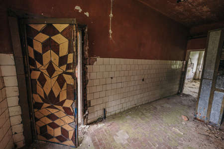 A large brick building with a tiled floorの写真素材