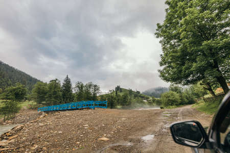 A car driving down a dirt roadの写真素材