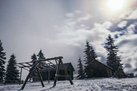 A man riding on top of a snow covered slopeの写真素材