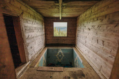 A room that has a sign on a wooden surfaceの写真素材
