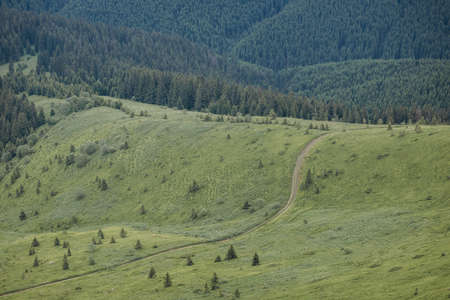A train is on the side of a mountainの写真素材