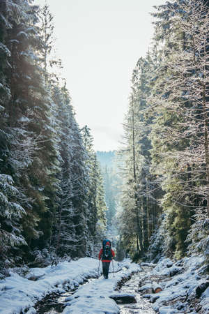 A man riding skis down a snow covered slopeの写真素材