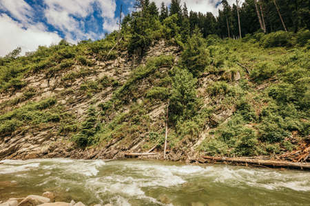 A large waterfall over a body of waterの写真素材