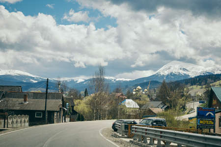 A train is parked on the side of a roadの写真素材