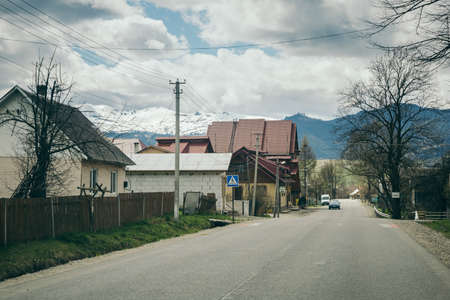 A house that has a sign on the side of a roadの写真素材