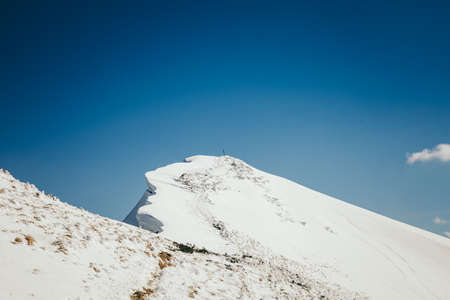 Snow in the mountains, coniferous forest, spring and winterの写真素材