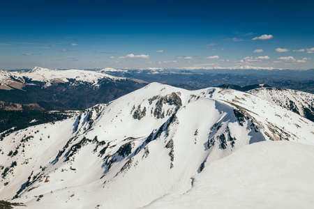 Snow in the mountains and blue sky, springの写真素材