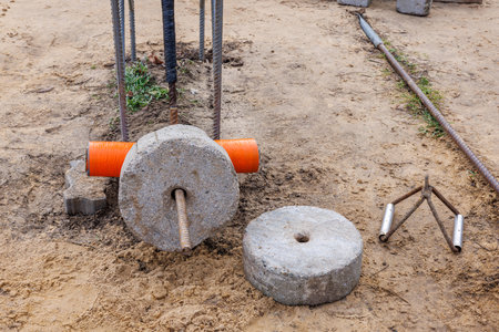 Concrete weights on the sand of an outdoor area.の写真素材