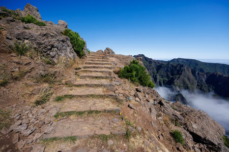 Beautiful view of the Stairway to Heaven on the Pico do Areeiro trail. Clouds underfoot. Madeira,...