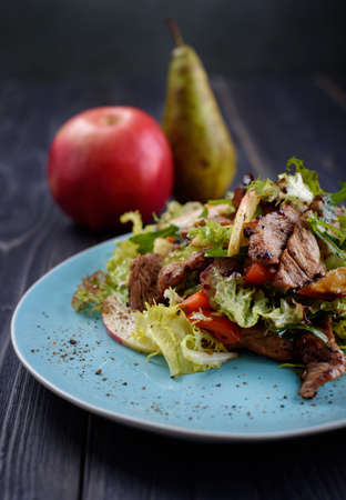 Veal medallions salad with apple, pear and cheeseの写真素材