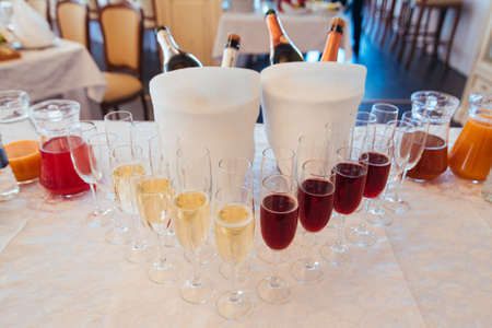 Set of wine glasses with different types of wine. White and red champagne in glasses. Wedding banquetの写真素材