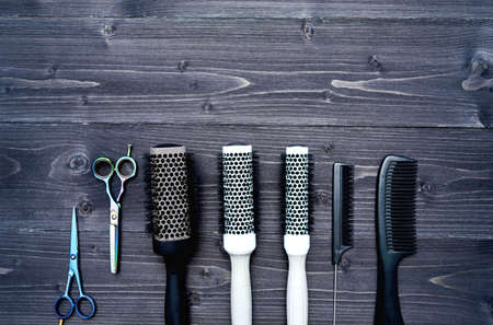 Hairdresser tools on wooden backgroundの写真素材