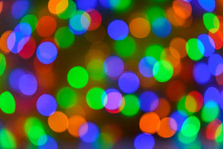 Christmas bokeh background, copy space. Defocused new year bokeh lights, free space. Blurred bokeh. Abstract holiday glitter backgroundの写真素材