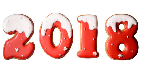 2018 happy new year sign symbol from red and white gingerbread cookies isolated on white background. Happy New Year 2018 and merry Christmasの写真素材