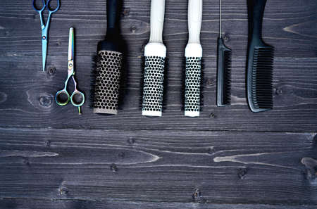 Hairdresser tools on wooden backgroundの写真素材