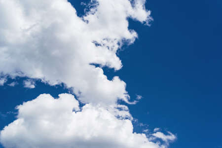 Beautiful white clouds against blue sky background, copy space. Light blue sky with clouds, free spaceの写真素材