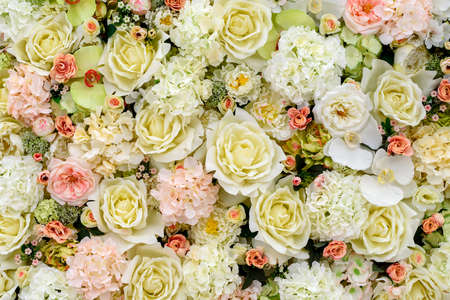 Beautiful artificial flowers background for wedding scene, free space. Floral background, copy...