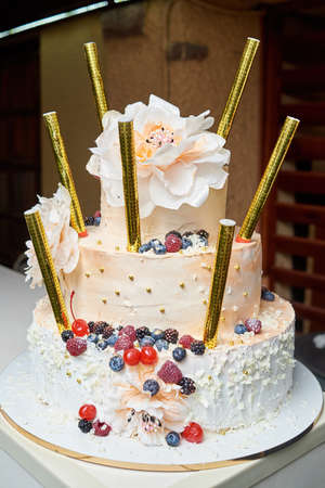 White Multi Level Birthday Or Wedding Cake With Flowers Berries Multi Level Birthday Or Wedding Cake