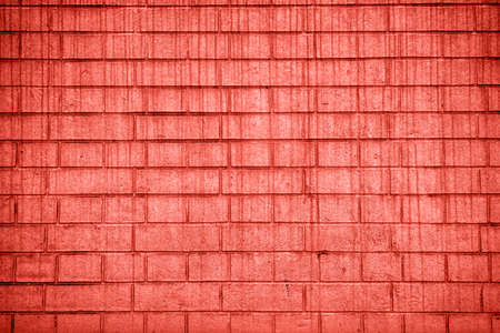 Living Coral background of grunge brick wall texture; copy space. Color of the year 2019. Top view; flat layの写真素材
