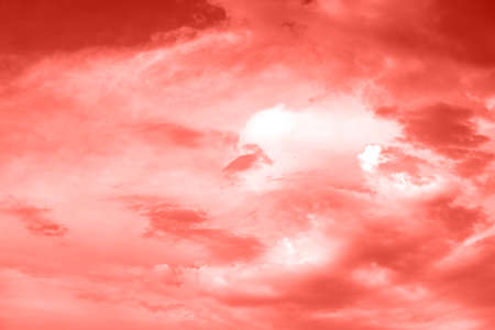 Sky with clouds, copy space. Living Coral background. Color of the year 2019. Nature heaven backgroundの写真素材