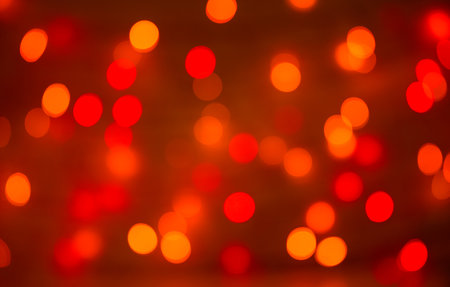 Christmas bokeh background, copy space. Defocused new year bokeh lights, free space. Blurred red and green bokeh. Abstract holiday glitter background. Lens flare patternの写真素材