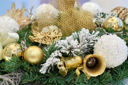 Close up of Christmas wreath decorated with white and golden baubles, copy space. Winter holidays concept. Christmas backgroundの写真素材