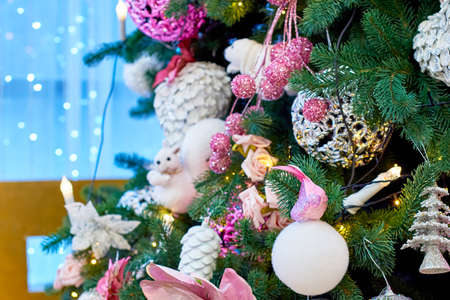 Closeup of decorated Christmas tree on blue blurred, sparkling background, copy space. Christmas decorations. Holiday background. Greeting cardの写真素材