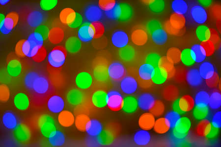 Christmas bokeh background, copy space. Defocused new year bokeh lights, free space. Blurred bokeh. Abstract holiday glitter background. Lens flare patternの写真素材