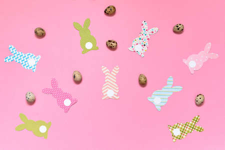 Easter bunny decoration and eggs on blue background, copy space. DIY holiday handicraft. Flat lay, top view. Happy Easter conceptの写真素材