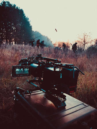 shooting a film at dawn, one camera in standby mode, the second group in force to shoot in the...