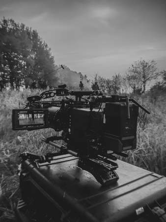 shooting a film at dawn, one camera in standby mode, the second group in force to shoot in the backgroundの写真素材