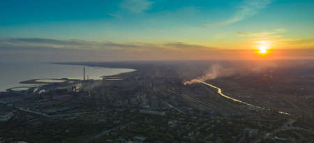 Industrial city in summer. On the horizon, a metallurgical plant near the sea. Aerial view. Mariupol, Ukraine - Drone Hyperlapseの写真素材