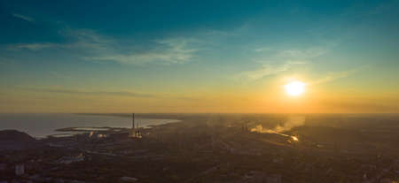Industrial city in summer. On the horizon, a metallurgical plant near the sea. Aerial view. Mariupol, Ukraine - Drone Hyperlapseの写真素材