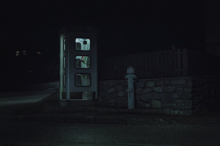 night telephone booth. mystical and mysterious street phone. dangerous place on an empty street